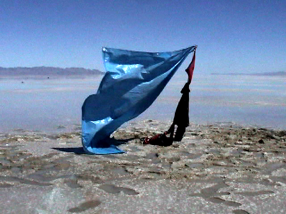 video still of a tarp dancing in the wind on the Bonneville Salt Flats