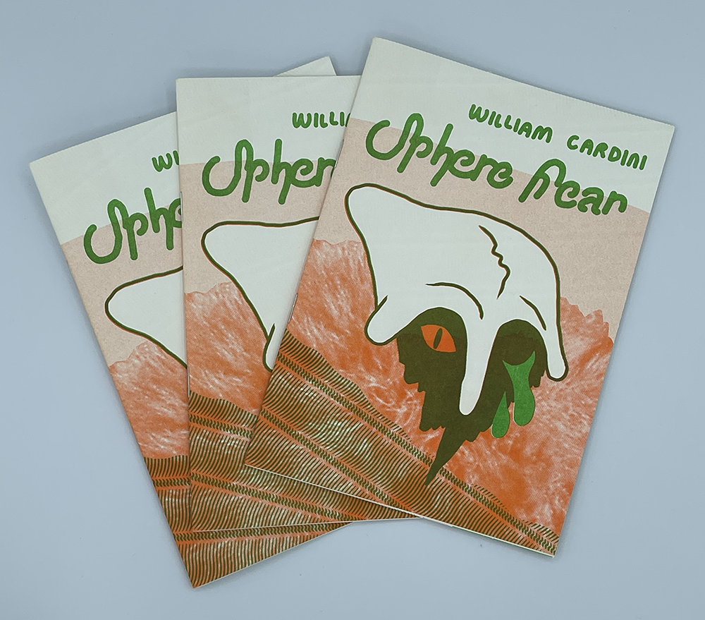 Photo of three copies of the Will Cardini mini-comic Sphere Fear in a loose stack. The mini-comics are orange, brown, and green. The cover shows a strange, helmeted figure with one orange, reptilian eye open and the other dripping green tears.